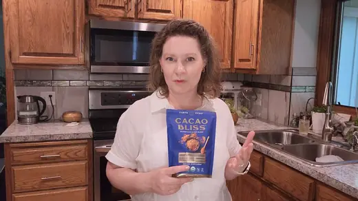 Ruth C. holding a bag of Cacao Bliss
