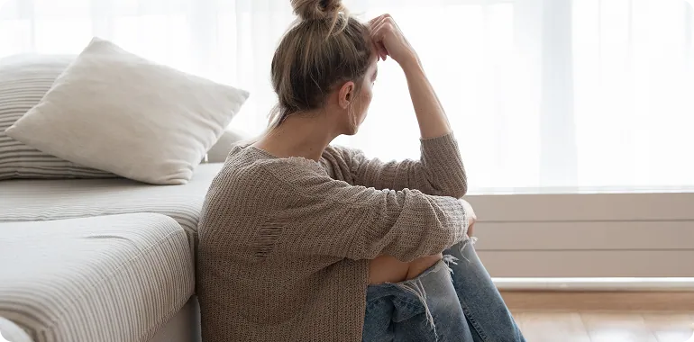 Woman sitting on couch