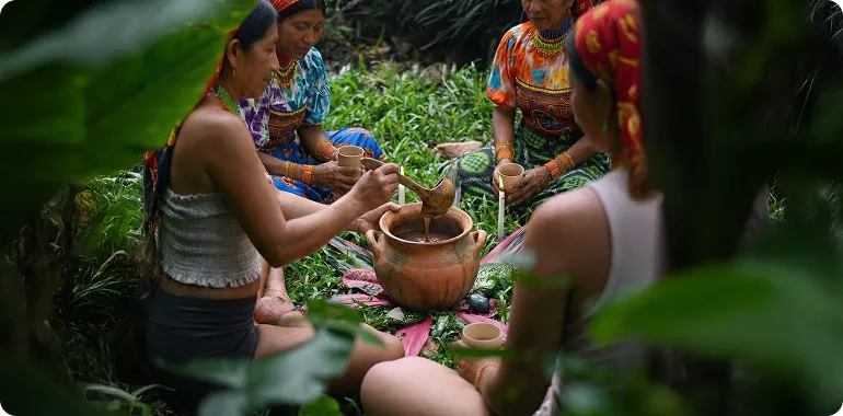 Tribe members preparing cacao
